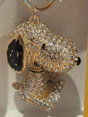NIB Peanuts Snoopy gold and Black Bag Charm/ keychain